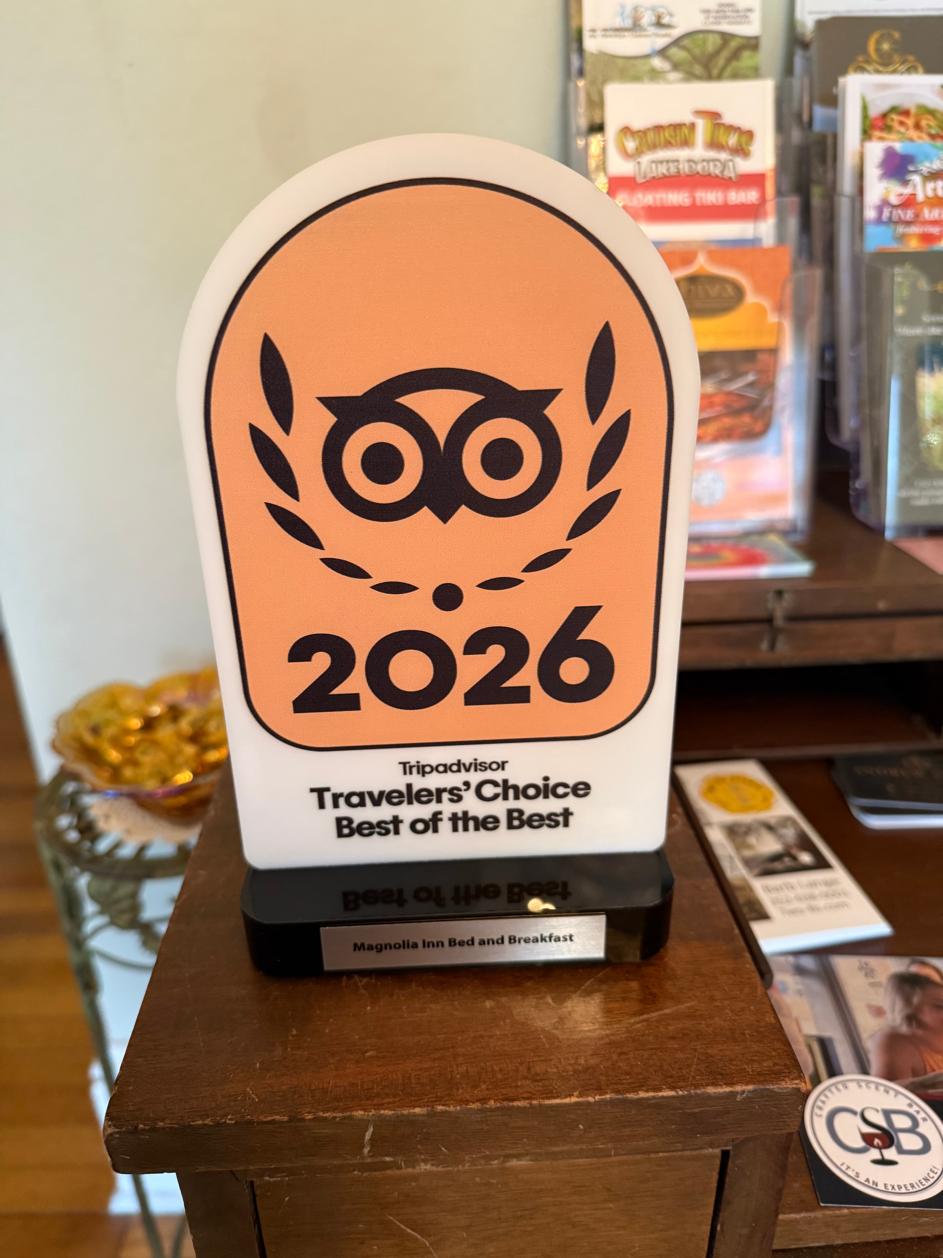 A TripAdvisor Travelers' Choice award for 2026 displayed on a countertop.